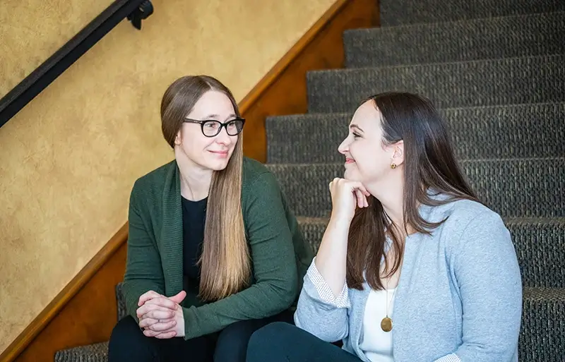 professional-services Two therapists talking together